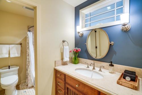 a bathroom with a sink and a mirror at Scenic Carmel Valley Home with Deck Steps to River! in Carmel Valley
