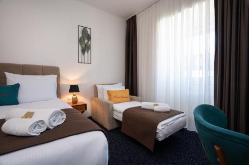 Postel nebo postele na pokoji v ubytování Hotel Šumava