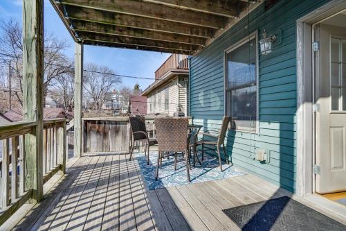 a patio with chairs and a table on a house at Pet-Friendly Saint Paul Vacation Rental with Deck! in West Saint Paul