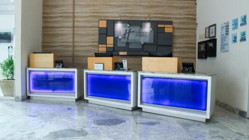 a room with three blue screens and a tv at Holiday Inn Express & Suites - Ciudad Obregon by IHG in Ciudad Obregón