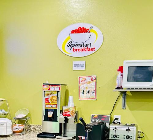 a supermarket breakfast sign on the wall of a store at Forest City Inn in Forest City