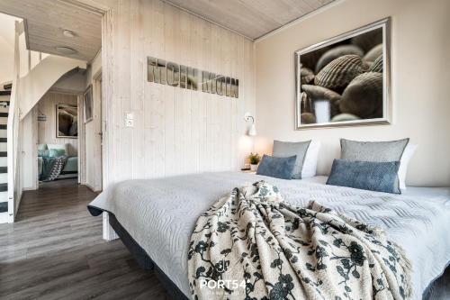 En eller flere senge i et værelse på Ferienhaus Ankerplatz Marina Wendtorf