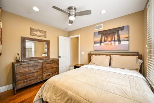 a bedroom with a bed and a dresser and a mirror at 50 Steps to the Sand on 39th St - Newport Beach in Newport Beach