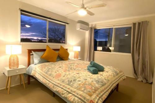 a bedroom with a bed with a pillow on it at Spacious 4-Bedroom house in a shared property in Harristown