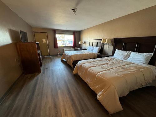 Ένα ή περισσότερα κρεβάτια σε δωμάτιο στο Clintonville Motel