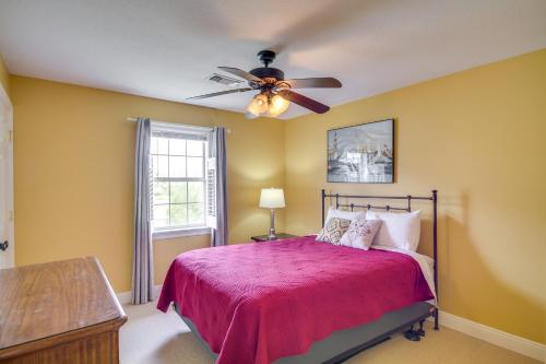 a bedroom with a bed and a ceiling fan at Fish at Canalfront Bay St Louis Home - Dock and Deck in Shoreline Park