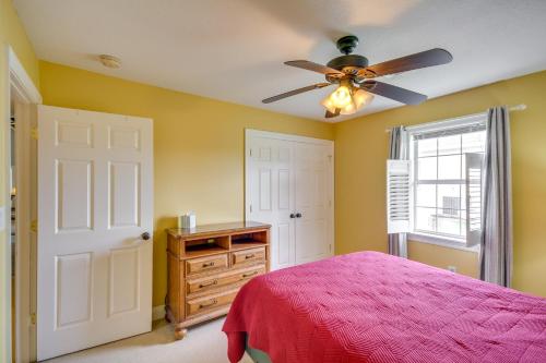 a bedroom with a bed and a ceiling fan at Fish at Canalfront Bay St Louis Home - Dock and Deck in Shoreline Park