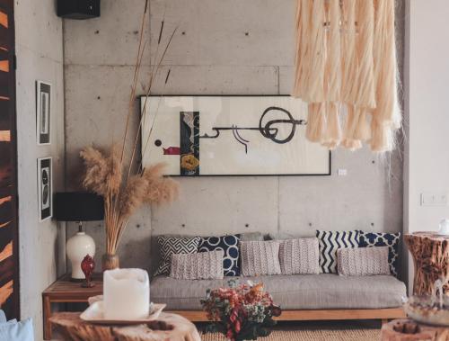 a living room with a couch and a table at Cuna del Cielo in San Miguel de Allende