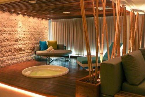 a living room with a couch and chairs and a table at Hotel Nacional Rio de Janeiro in Rio de Janeiro