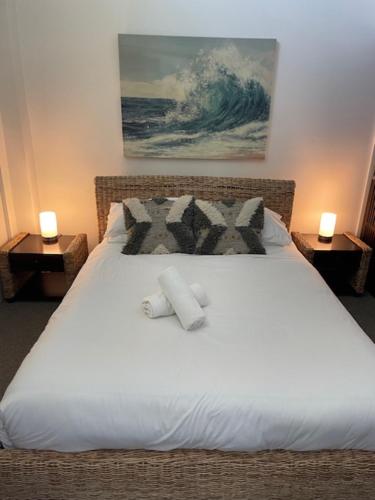 a bedroom with a bed with two pillows on it at 338 Paradiso Kingscliff Beach in Kingscliff