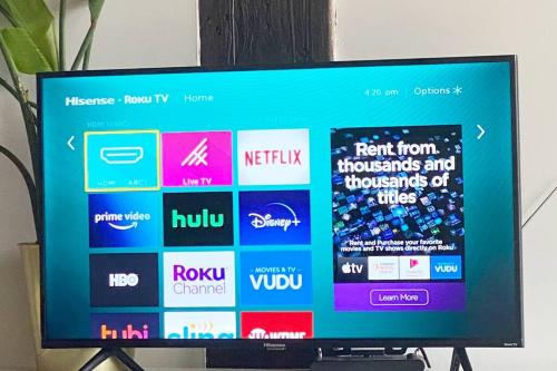 a television screen with a bunch of logos on it at 420 Friendly BOHO Loft Downtown KING suite FREE parking in Detroit