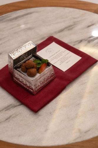 a box of food sitting on top of a table at Svarga Bebek Villas in Ubud