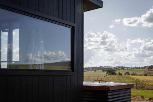 a window of a building with a view of a field at Rest at BoxGrove in Bathurst