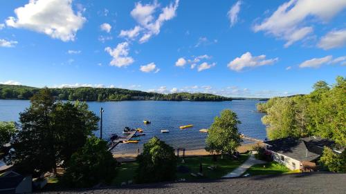 a view of a lake with boats in the water at Bonnie View Inn in Haliburton