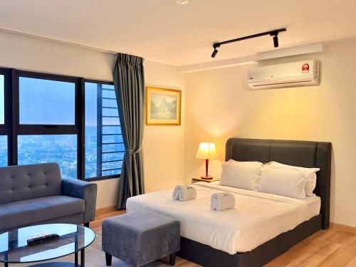 a bedroom with a bed and a chair and a window at Entire Loft Hosted by Forave Home Wi-Fi 500mbps in Kuala Lumpur