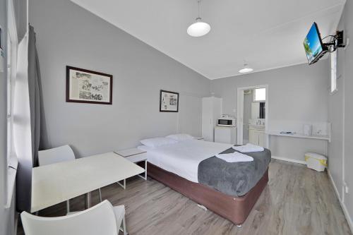 Ένα ή περισσότερα κρεβάτια σε δωμάτιο στο Ned Kelly's Motel