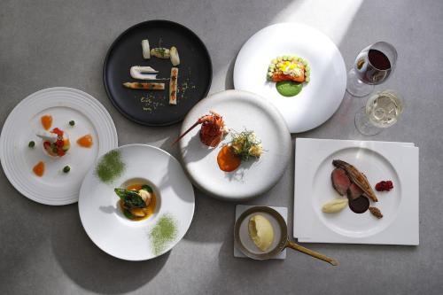 a group of plates of food on a table at Tokyo Marriott Hotel in Tokyo