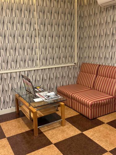 a living room with a couch and a coffee table at STYLISH in Kobe