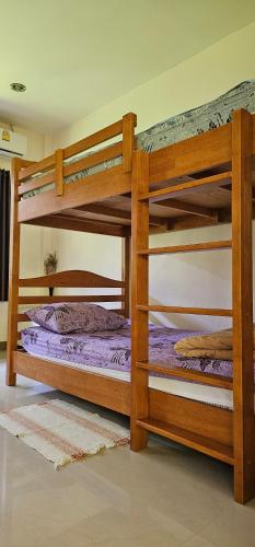 Postel nebo postele na pokoji v ubytování Pakin house