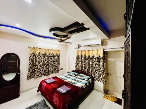 a bedroom with a bed and a ceiling at Crystal dew in Visakhapatnam