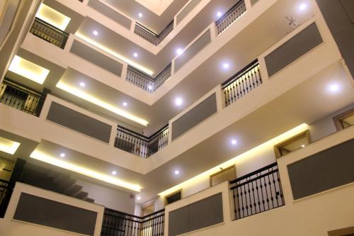 a building with a ceiling with lights on it at Ahuja Residency Mayfield Garden in Gurgaon