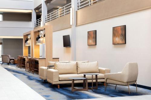 a lobby with couches and chairs and a bar at Fairfield Inn & Suites by Marriott Denver Southwest/Lakewood in Lakewood