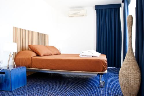 Кровать или кровати в номере Nisí