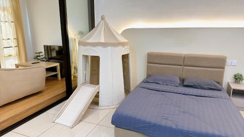 a bedroom with a bed with a white canopy at Mount Austin Manhanttan Sovo by Cactus Homestay in Johor Bahru