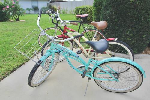 two bikes parked next to each other on a sidewalk at Sandpiper Stay in Port Saint Lucie