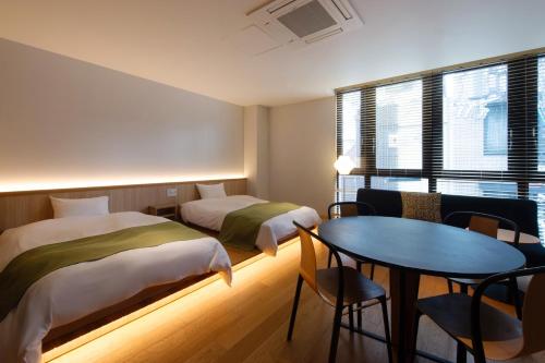 Postel nebo postele na pokoji v ubytování Design Hotel Kyoto Fuyacho