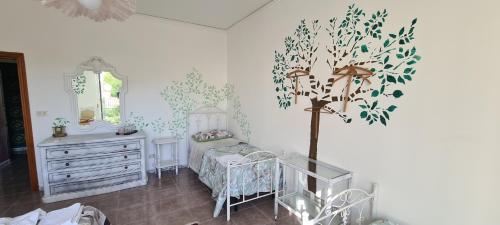 a bedroom with a bed and a dresser and a mirror at I Sollazzi in Palermo