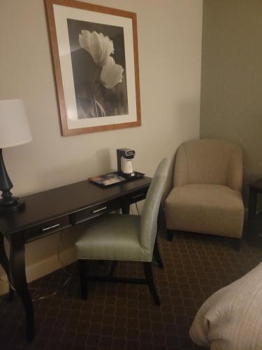 a desk and a chair in a hotel room at Natural Bridge Hotel, Trademark Collection by Wyndham in Natural Bridge