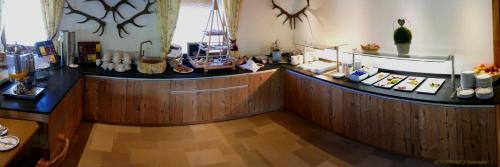 a kitchen with a counter with food on it at Das Naturhotel die Eng in Hinterriss