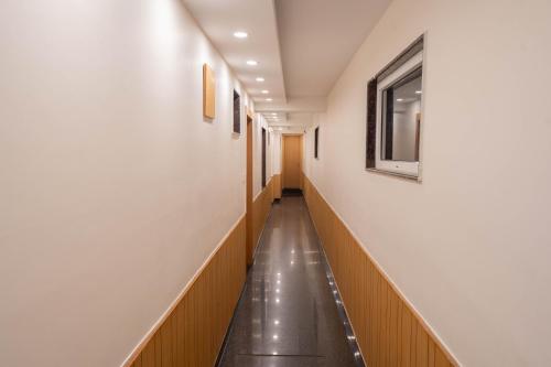 a hallway of a hospital with a long corridor at Super Hotel by Perfectstayz Mall Road in Mussoorie