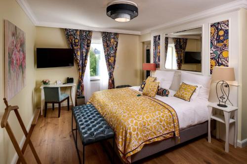 En eller flere senge i et værelse på Hotel The Rose by Goeres