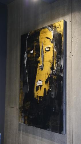a painting of a mans face on a wall at Hotel Battisti 31 in Brescia