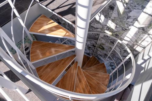 an overhead view of a spiral staircase with wood floors at 海都-kaito- TOKYOBAY in Futtsu