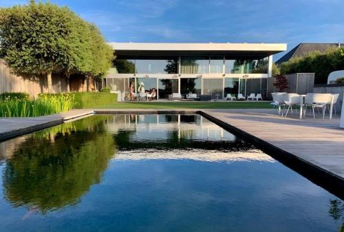 Luxurious villa with pool sauna and swimming pond