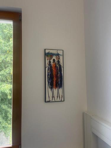 a picture hanging on a wall in a room at Seven Seven B&B in Arusha