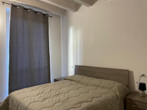 Ένα ή περισσότερα κρεβάτια σε δωμάτιο στο Dimora San Giulio