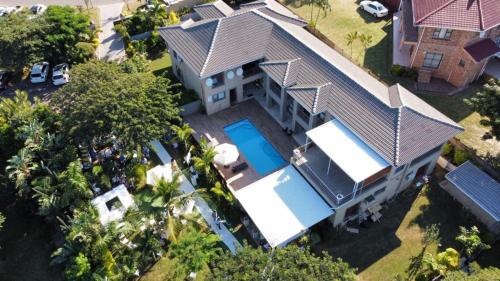 an overhead view of a house with a swimming pool at M-crystals in Richards Bay