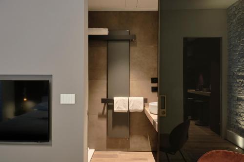 a bathroom with a sink and a mirror at SERENDIPITY apartments in Alba