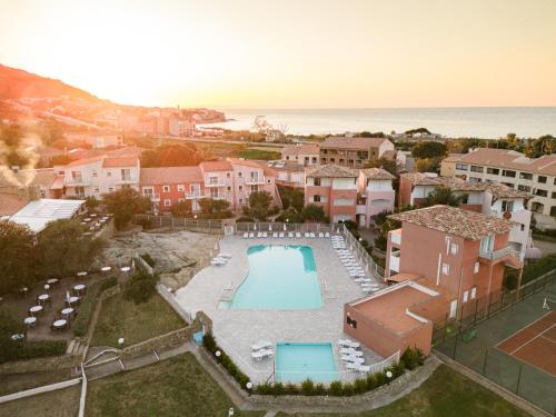 an aerial view of a resort with a swimming pool at Ferienhotel Maristella in Algajola