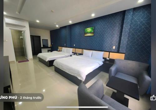 Ein Bett oder Betten in einem Zimmer der Unterkunft Hưng Phú Hotel HCM