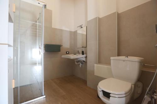 a bathroom with a toilet and a sink and a shower at Residence Superstar in San Martino di Lupari