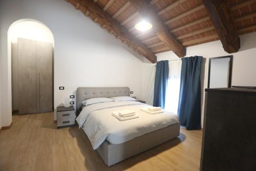 a bedroom with a bed and a large window at Residence Superstar in San Martino di Lupari