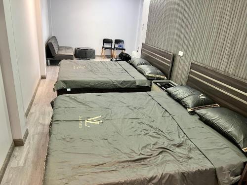 Ένα ή περισσότερα κρεβάτια σε δωμάτιο στο HOMESTAY ĐỒI GIÓ