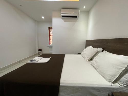 Una cama o camas en una habitación de RK Residency Calicut