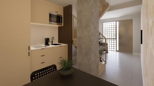 una cucina con un tavolo e un piano di lavoro di Style Madrid Center Santiago Bernabeu a Madrid