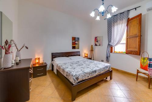 Postel nebo postele na pokoji v ubytování Case Vacanze Castellana Dream